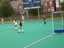 Me, on the right playing field hockey at Drexel on a hot summer night. 